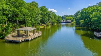 a dock on a river with a boat in the water